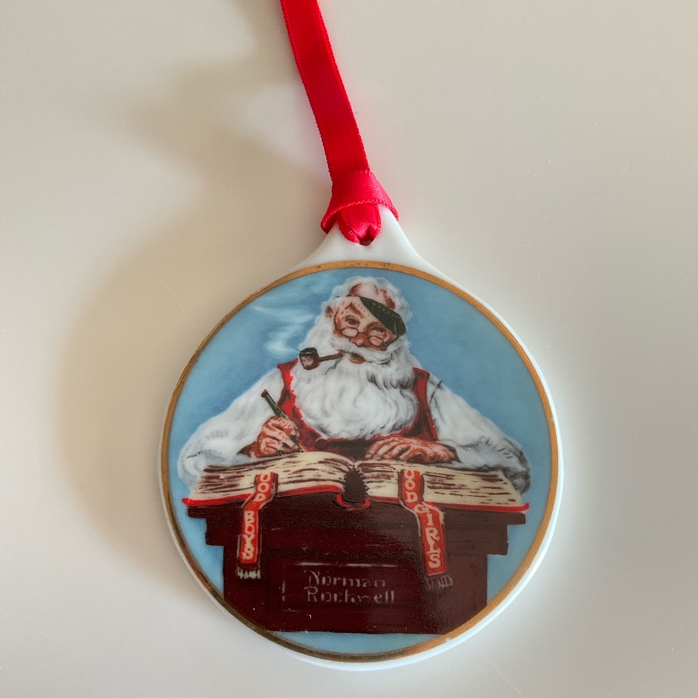 Norman Rockwell checking his list ornament